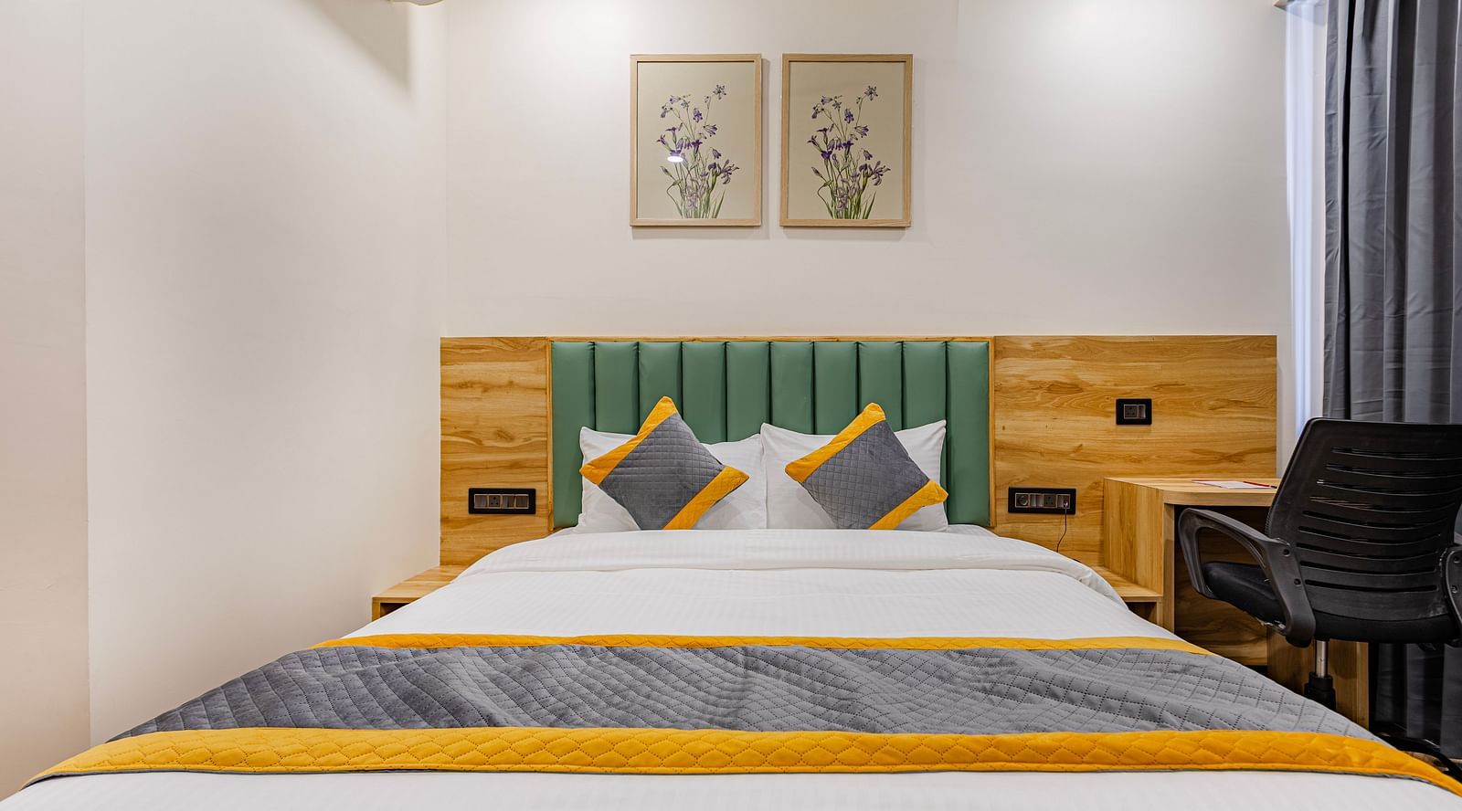 Lemonridge Hotels, KPHB | Lemon Ridge Hotels, KPHB: Hotel room with a double bed, headboard, and artwork on the wall. Clean and simple design.